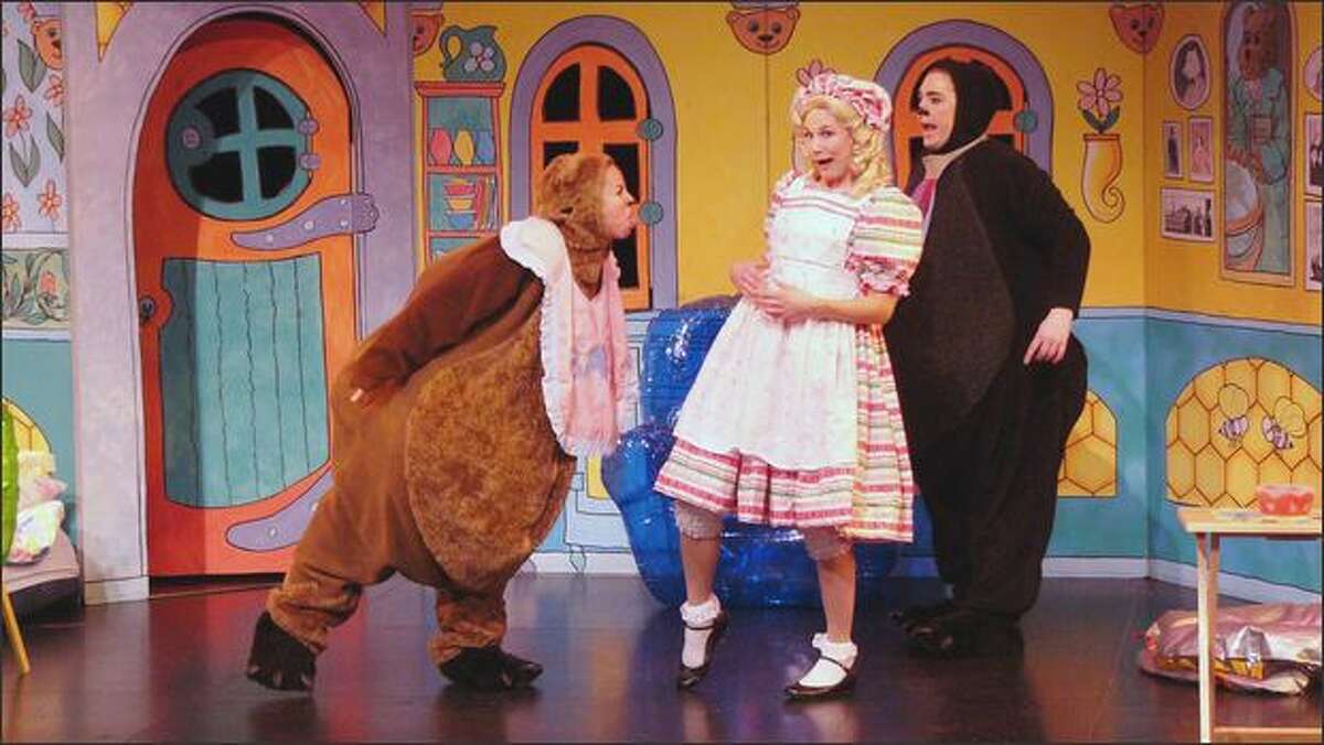Baby Bear (Amy Jo LaRubbio) and Goldilocks (Nicole Fierstein) get in a little fight while Papa Bear (Amy Hicks) tries to mediate in StoryBook Theater’s "Goldilocks and the Three Bears."