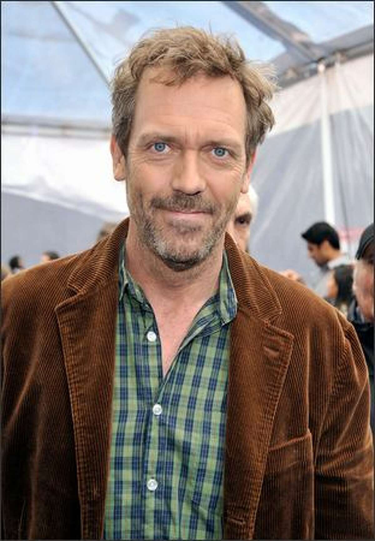 Actor Hugh Laurie arrives at the premiere of Dreamworks' "Monsters vs. Aliens" held at the Gibson Amphitheatre in Universal City, Calif.
