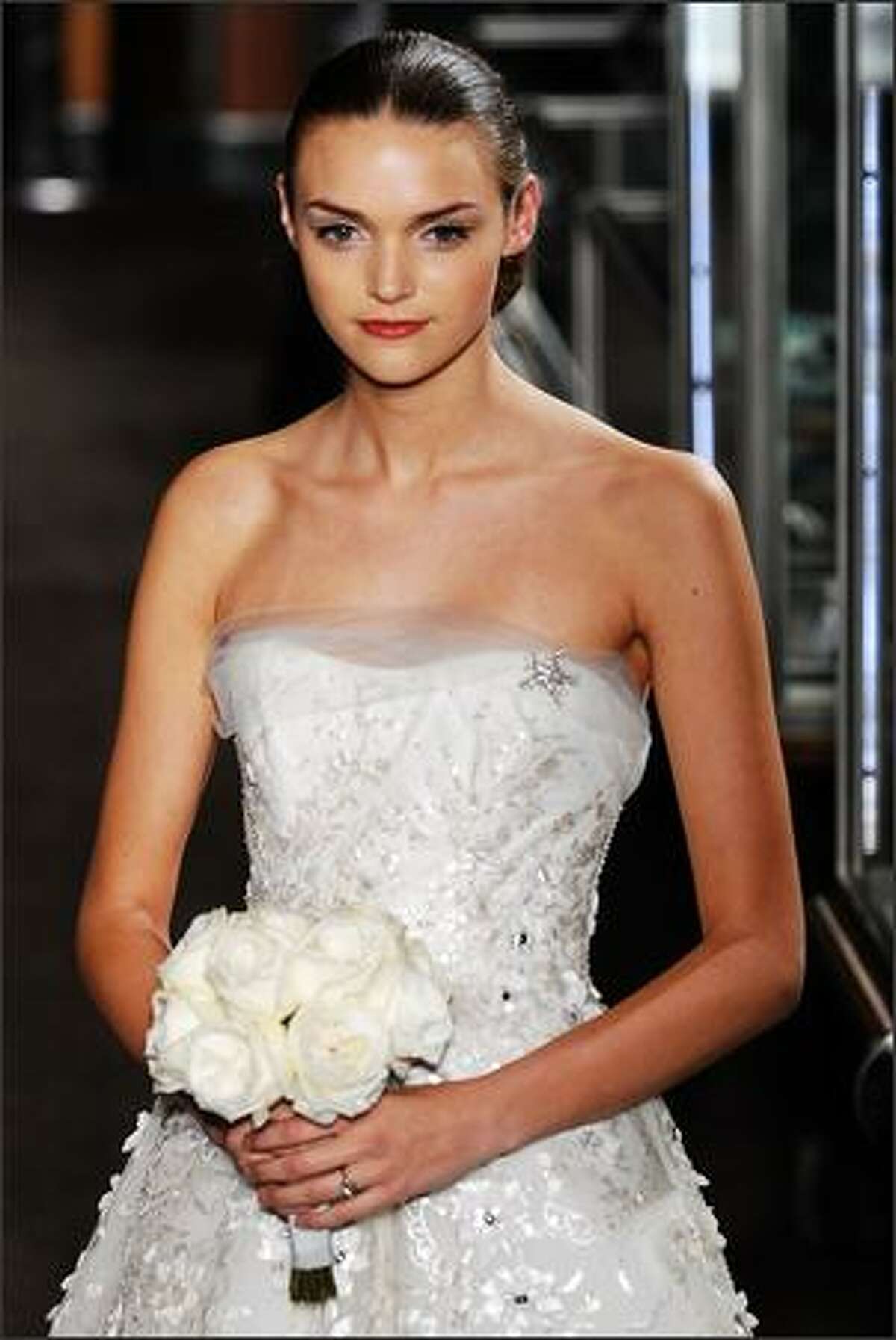A model walks the runway at the Carolina Herrera Spring 2010 Bridal Collection at Tiffany & Co., Fifth Avenue Flagship Store in New York City.
