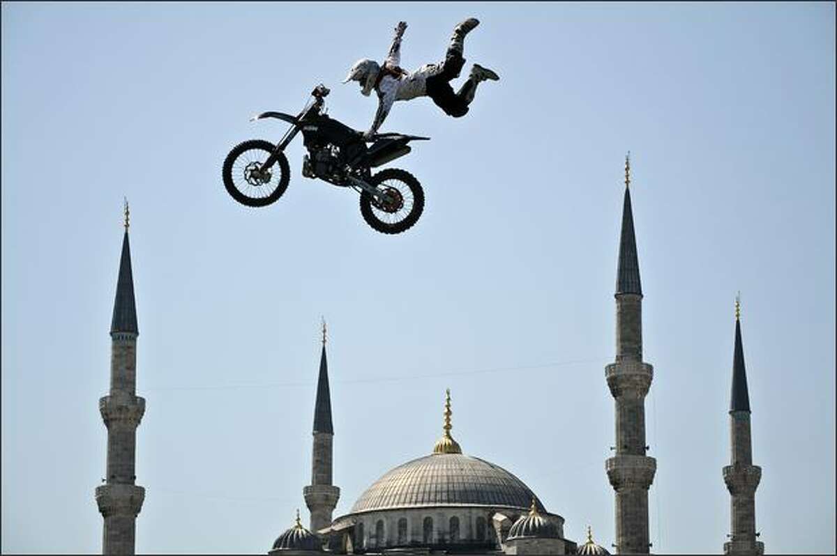 A German motocross biker performs in front of the Blue Mosque in Istanbul.