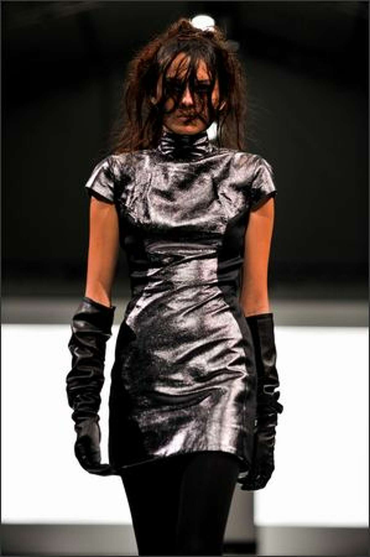 A model walks the runway wearing designs by Gareth Pugh on the closing catwalk at the Ngee Ann City Civic Plaza on day two of Audi Fashion Festival Singapore in Singapore on Thursday, May 7, 2009.