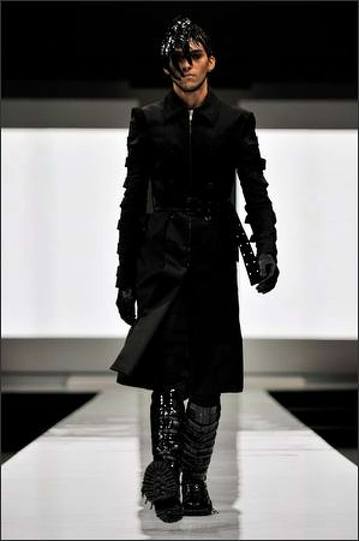 A model walks the runway wearing designs by Gareth Pugh.