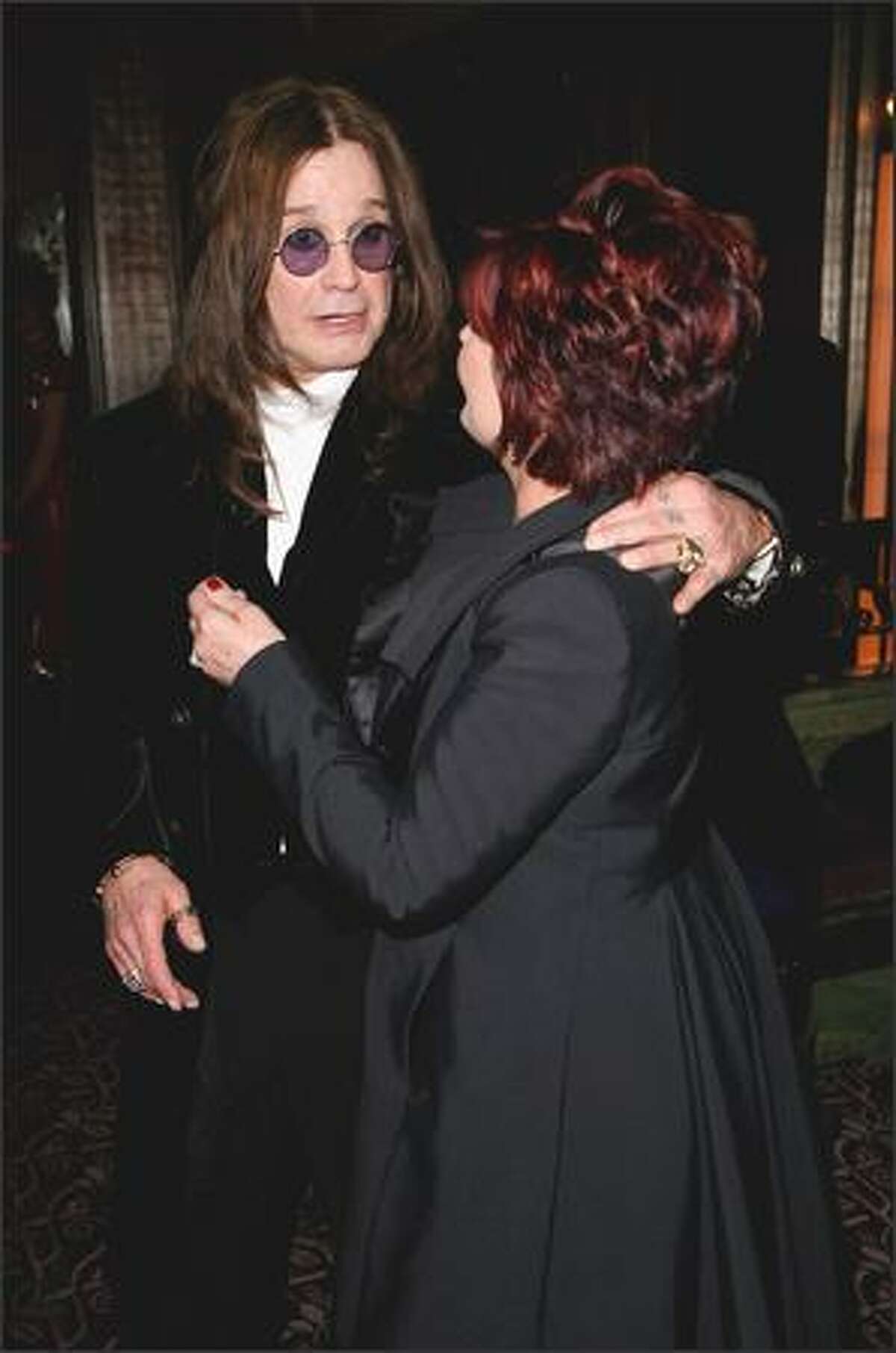 Ozzy Osbourne and Sharon Osbourne arrive for the Classic Rock Roll of Honour at the Park Lane Hotel on Monday in London.