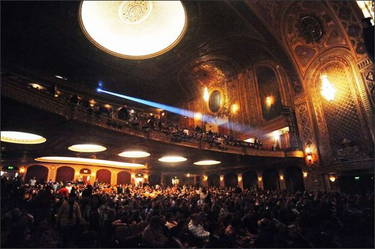 Fans begin seating inside the Paramount Theatre for the Flight of the Conchords concert.