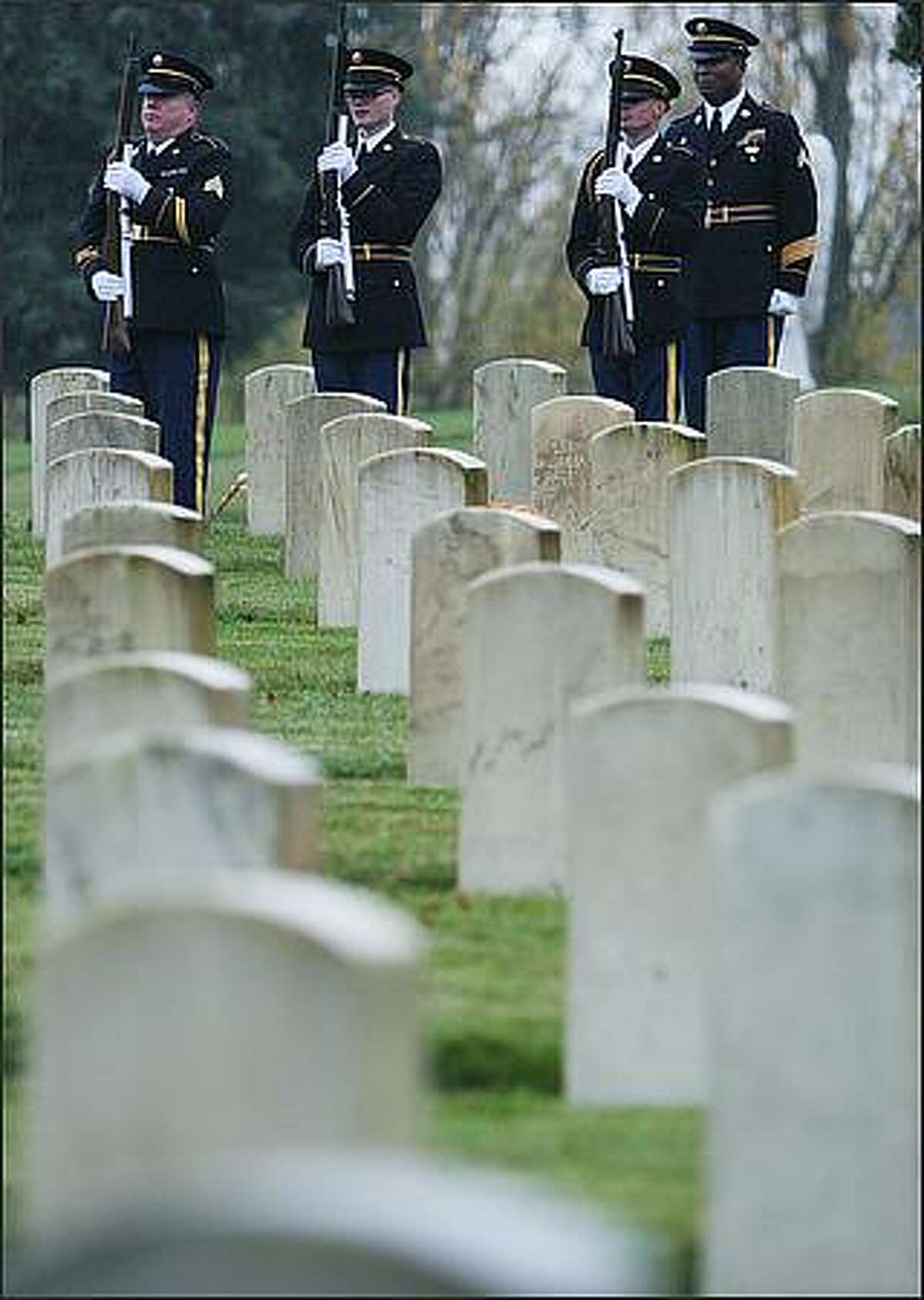 The 21-gun salute by the Washington State National Guard finishes during the 59th Annual Veterans Day of Remembrance.