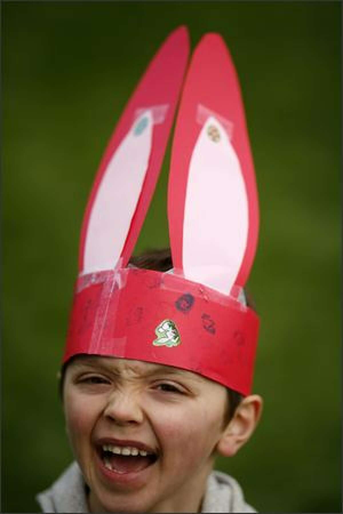Emmett Kineman shows off the bunny ears he made during the Woodland Park Zoo's Bunny Bounce on Saturday in Seattle. The event included an Easter egg hunt and other activities for kids.