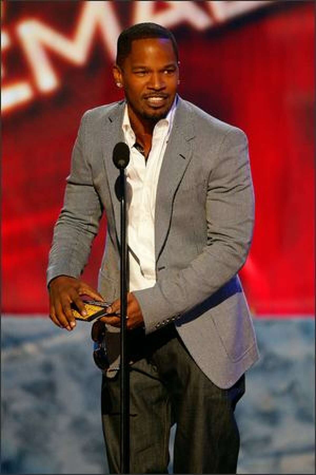 Actor Jamie Foxx presents the Soul/R&B Female Artist award onstage during the 2008 American Music Awards held at the Nokia Theatre in Los Angeles on Sunday, Nov. 23.