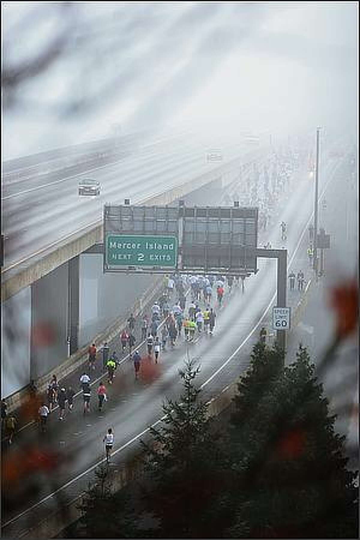 Runners make their way onto the I-90 floating bridge during in the 2008 Seattle Marathon.