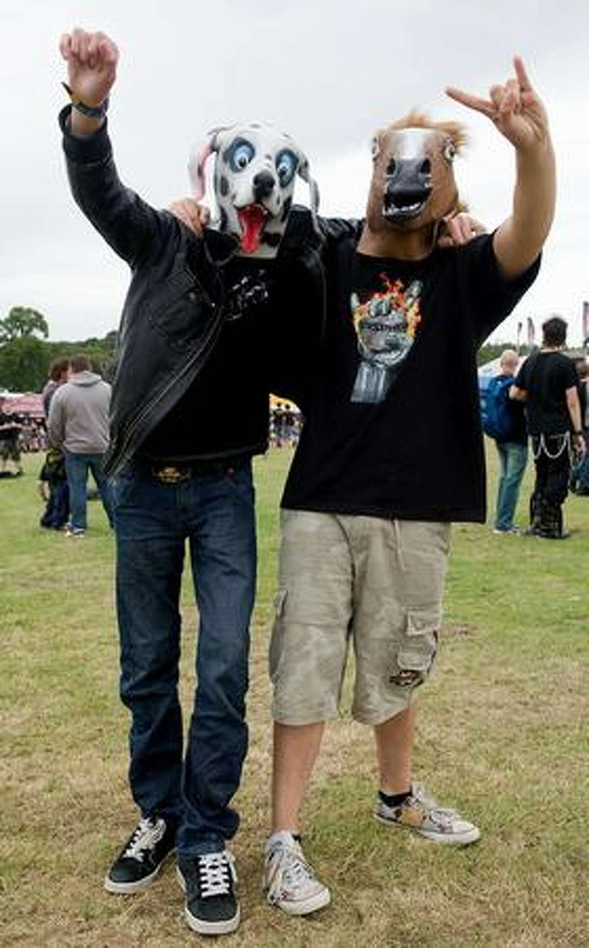 Two revellers wear animal masks at the Sonisphere rock festival at Knebworth, UK.