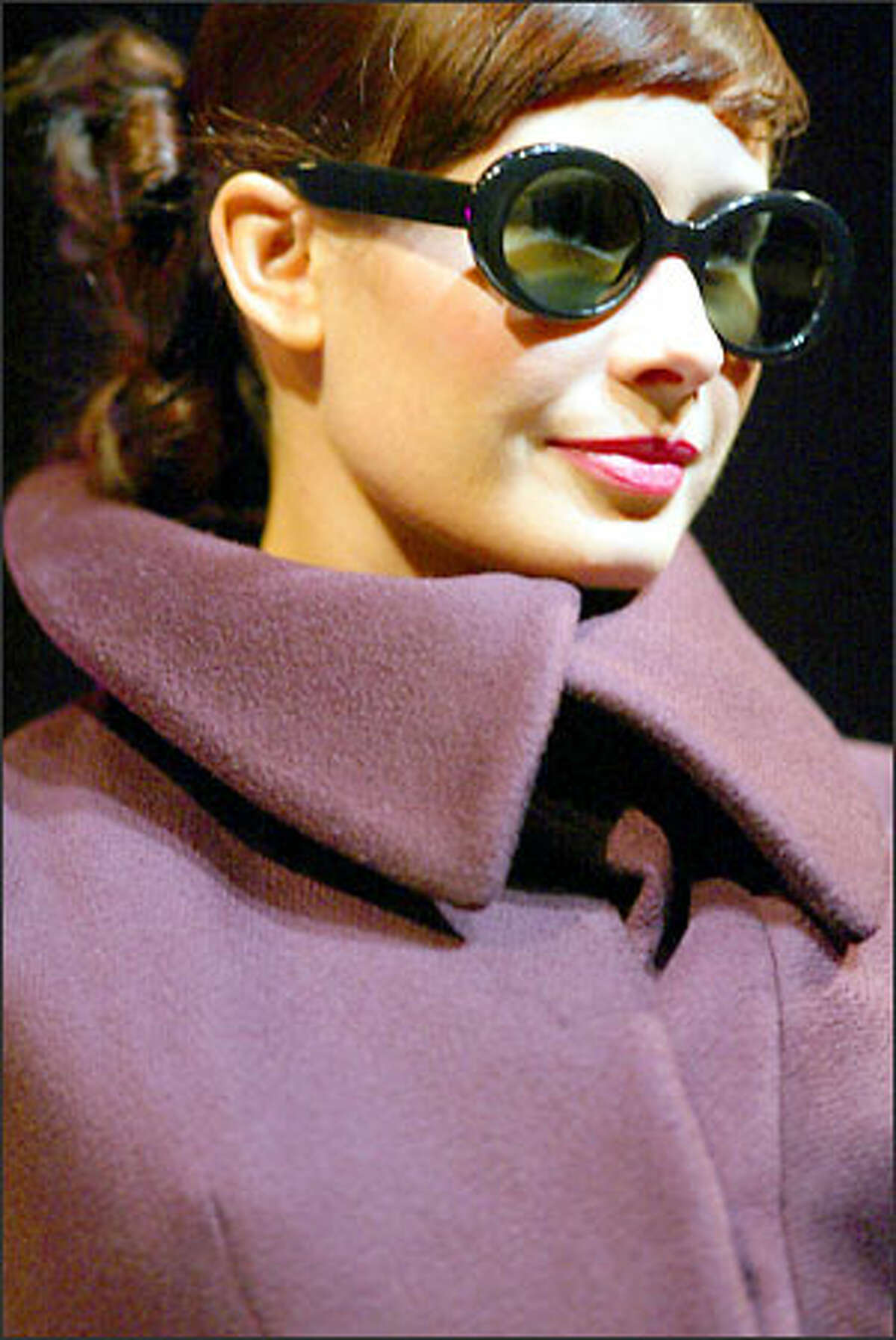 Designer Stella McCartney's cashmere coat has a huge, face-framing collar.
