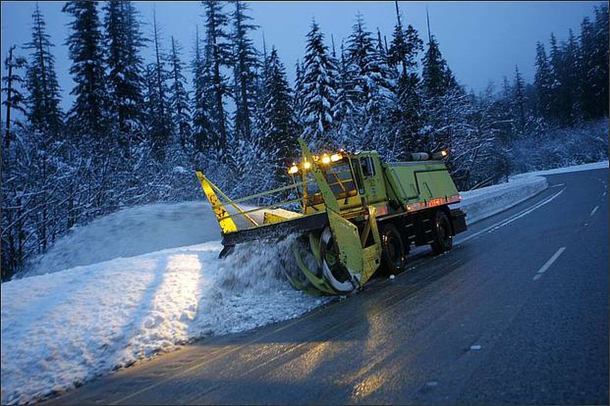 A snowblower clears the eastbound lanes of I-90 near exit 52 late Thursday afternoon.