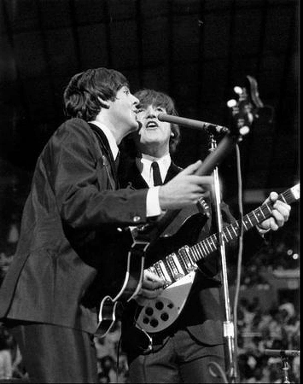 Paul McCartney and John Lennon, 1964. (Photo by Timothy Eagan)