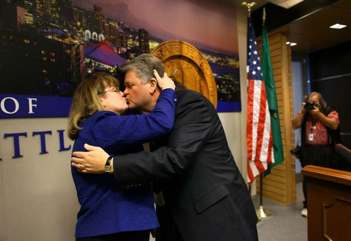 Seattle Mayor Greg Nickels kisses his wife, Sharon, after he concedes defeat during a press conference in the Mayor's Office.