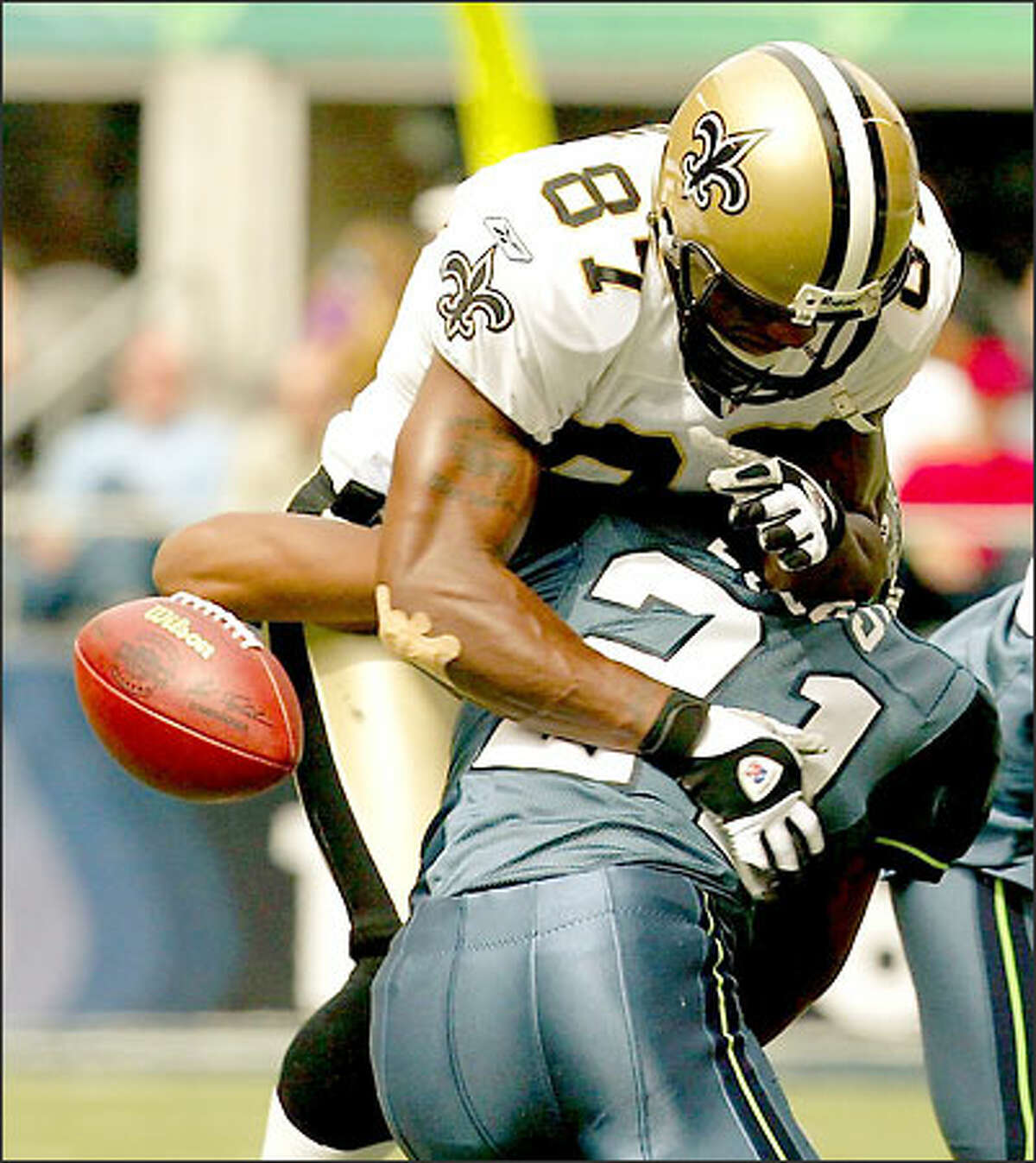 Cornerback Ken Lucas added to the hit list with this blow to Saints receiver Joe Horn.