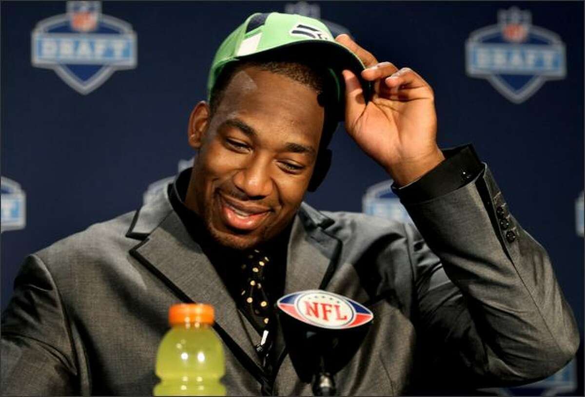 Linebacker Aaron Curry adjust his cap as he speaks to the media after being selected fourth overall in the first round of the NFL Draft by the Seattle Seahawks, Saturday, April 25, 2009, at Radio City Music Hall in New York. (AP Photo/Craig Ruttle)