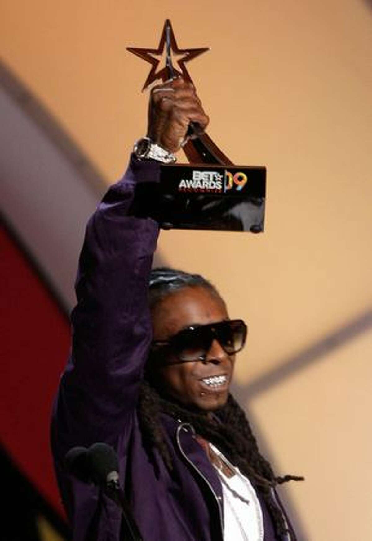 Rapper Lil' Wayne accepts the Best Male Hip-Hop Artist award on stage during the 2009 BET Awards held at the Shrine Auditorium on Sunday in Los Angeles, California.