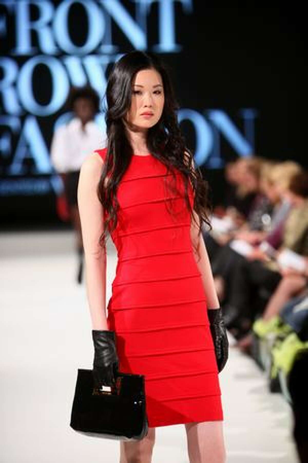 A model walks the runway during Vogue's Front Row Fashion show at the Hyatt Regency Bellevue.