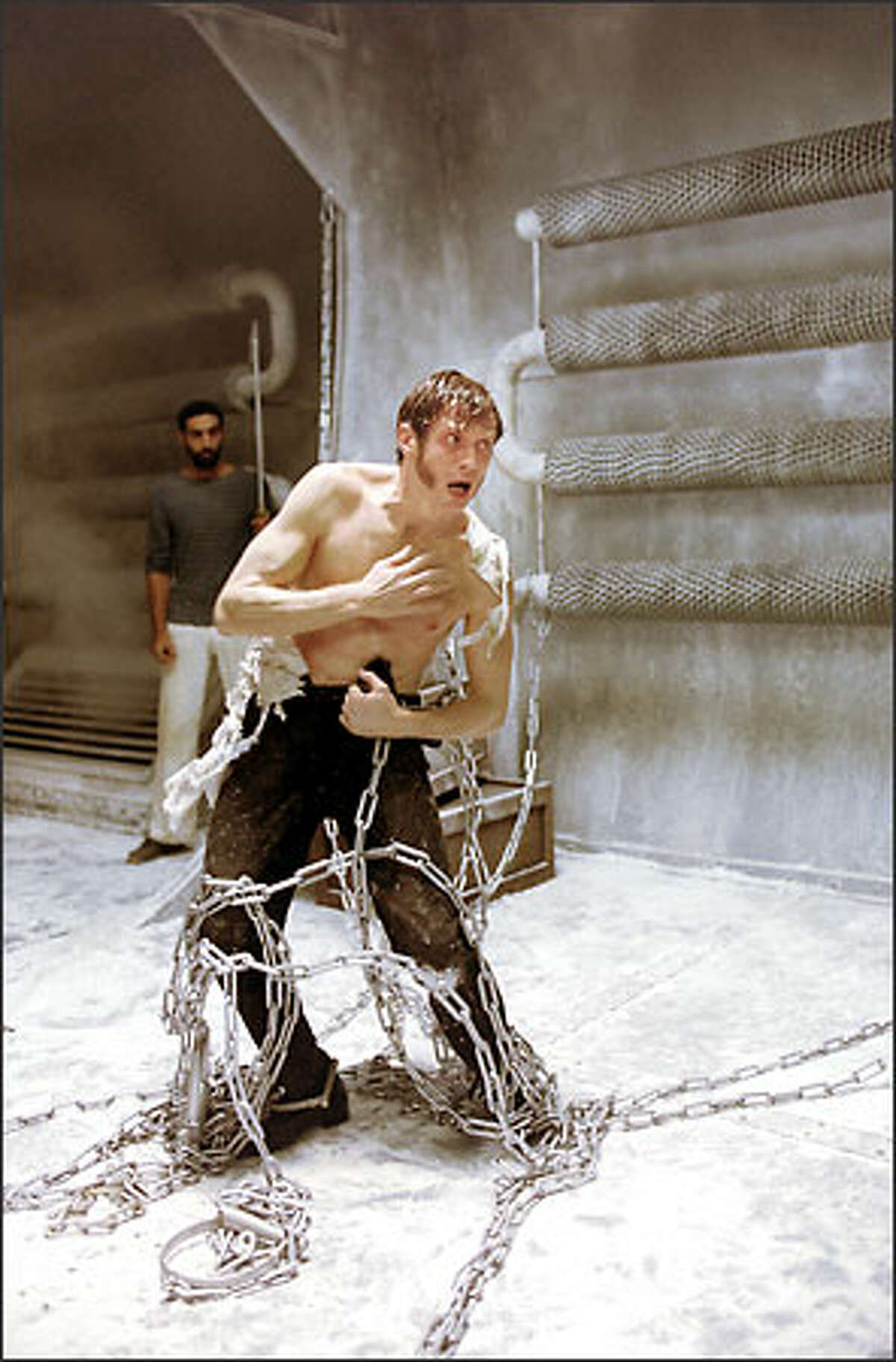 A securely restrained Dr. Jekyll (Jason Flemyng) begins the shocking transformation into the monstrous Mr. Hyde. A number of special-effects techniques were used for Hyde -- including CGI effects, models, midget actors and a massive prosthetic suit worn by Flemying. Author Robert Louis Stevenson created the dual character(s) in 1886.