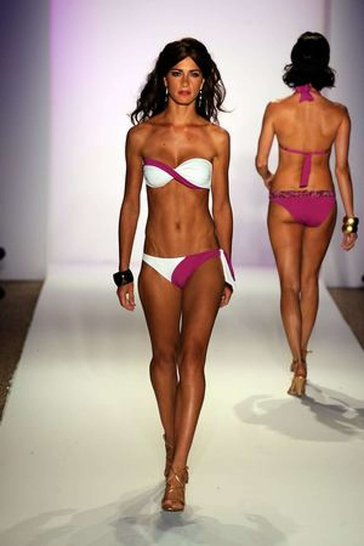 MIAMI BEACH, FL - JULY 17: A model walks the runway at the ANK by Mirla Sabino 2010 fashion show during Mercedes-Benz Fashion Week Swim at the Beachway at The Raleigh on July 17, 2009 in Miami Beach, Florida.
