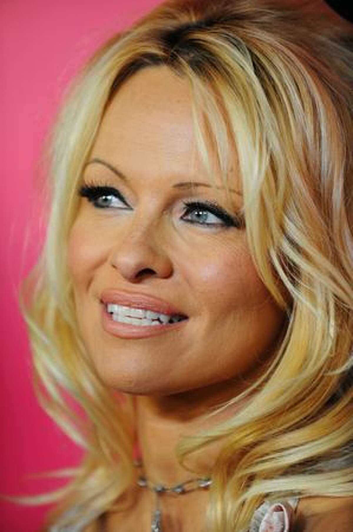 Actress Pamela Anderson arrives for the 6th Annual Hollywood Style Awards at Armand Hammer Museum in Los Angeles, California.