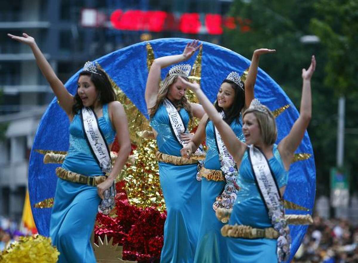Miss Sunnyside and her princesses ride on a float during the Seafair Torchlight parade on Saturday July 25, 2009 along 4th Avenue in Seattle.