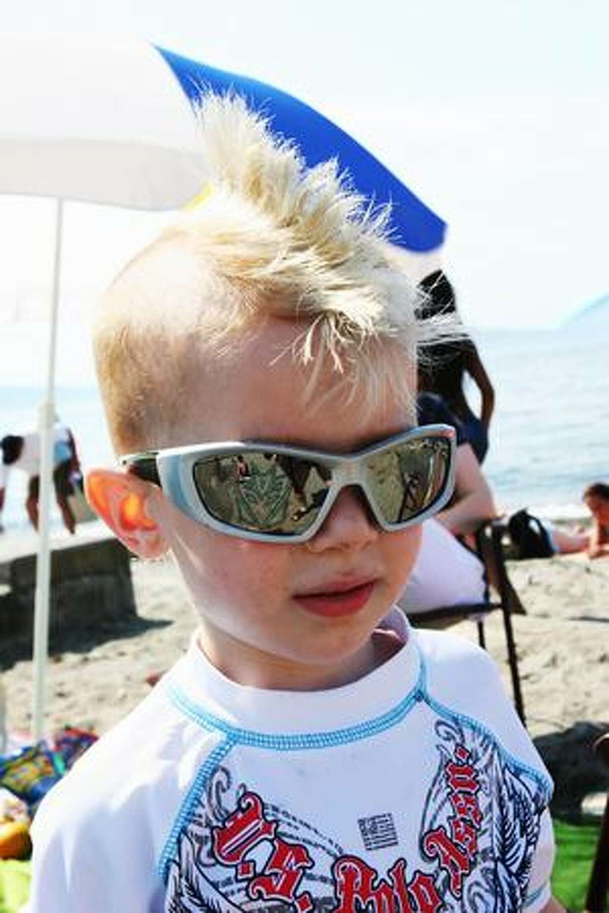 Conrad Kosa, 2, shows off his cool summer mohawk at Alki beach in West Seattle.