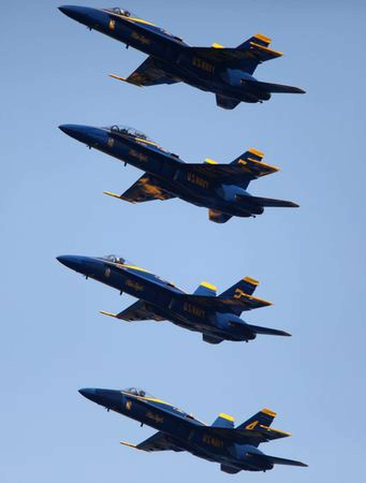The U.S. Navy Blue Angels demonstration team fly their Boeing F/A-18 Hornets over Lake Washington during a practice on Thursday in Seattle.