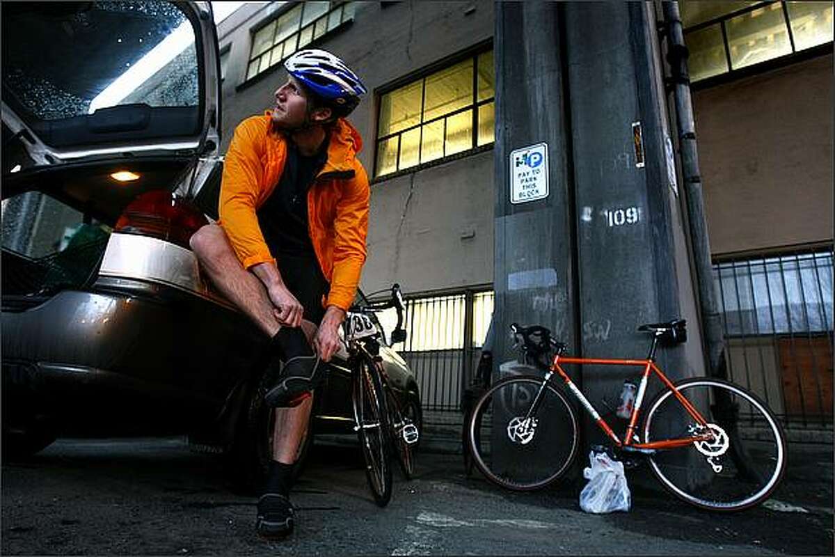 Chuck Sloan of Seattle gets his footwear in order underneath the Alaskan Way Viaduct before boarding the ferry for Bainbridge Island to take part in the Chilly Hilly bicycle ride.