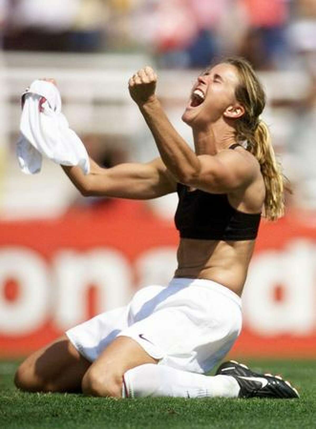 In this July 10, 1999 file photo, Brandi Chastain of the United States celebrates after kicking the winning penalty shot to win the 1999 Women's World Cup final against China at the Rose Bowl in Pasadena, Calif. (Photo by Roberto Schmidt/AFP/Getty Images)