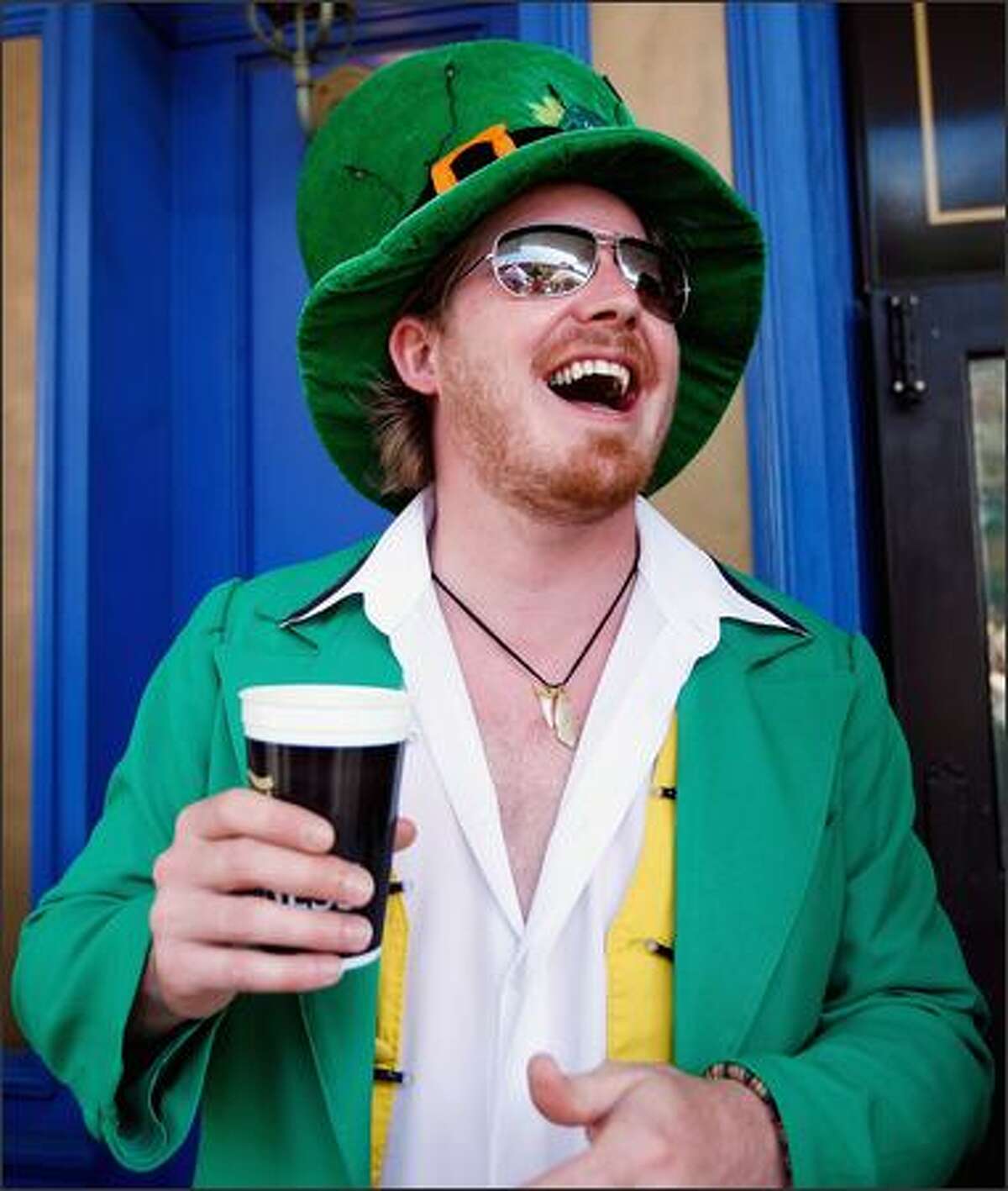 Donny Shanahan enjoys the festivities on St. Patrick's Day at the Muddy Farmer Bar in Auckland, New Zealand.