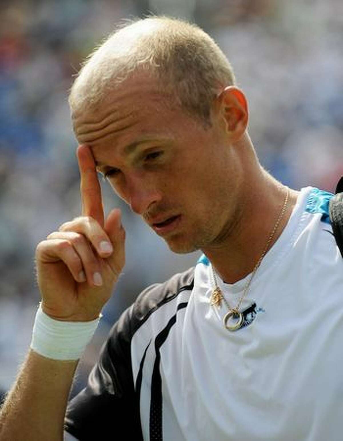 Nikolay Davydenko of Russia walks off the court after retiring due to injury against Robin Soderling of Sweden during their 4th round US Open match at the USTA Billie Jean King National Tennis Center in New York.