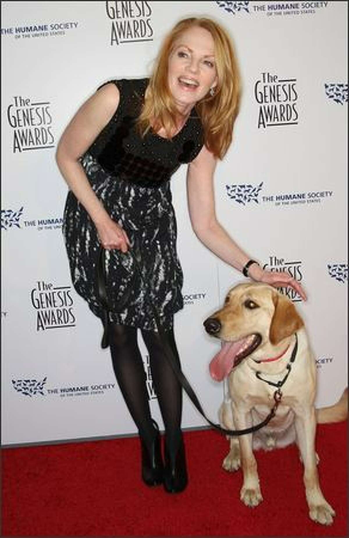Actress Marg Helgenberger and Marley attend the 23rd annual Genesis Awards at the Beverly Hilton Hotel in Beverly Hills, Calif.
