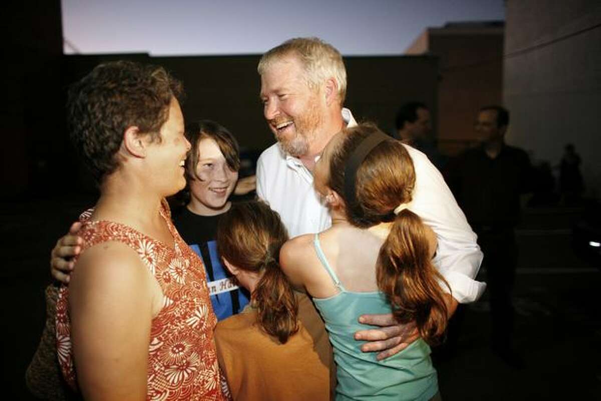 In 2009, McGinn (shown here celebrating with wife Peggy Lynch, sons Jack and Cian and daughter Miyo) defeated fellow Democrat Joe Mallahan by a less than 1 percent margin to succeed Gregory Nickels as Seattle mayor.