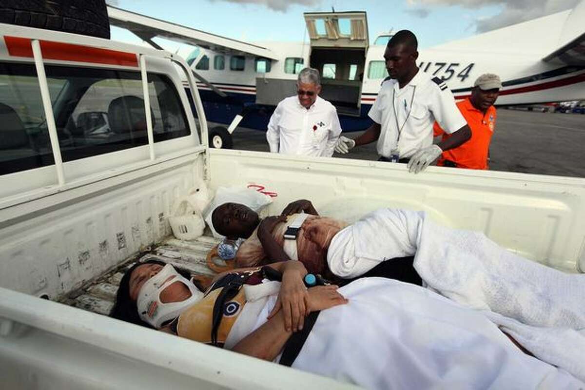 Injured people are prepared for air transport at the Port-au-Prince International airport on Jan. 13, 2010 in Port-au-Prince, Haiti.