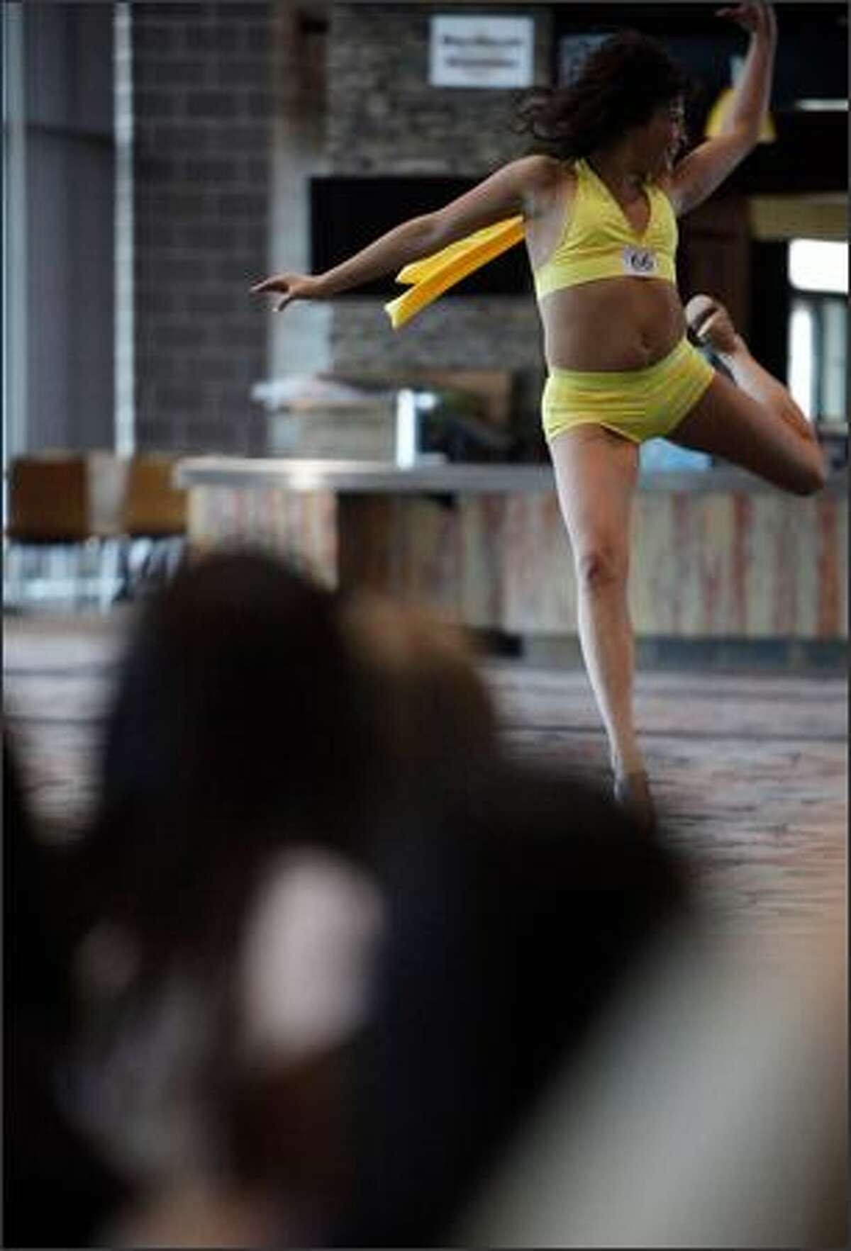 A participant tries out at the Sea Gals auditions at the Qwest Field West Club Lounge on Sunday.