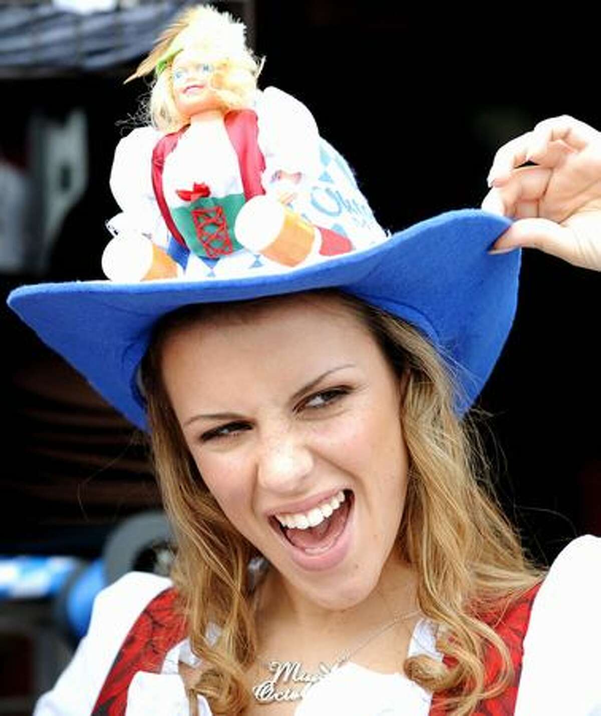 A women gestures during the Oktoberfest beer festival at the "Theresienwiese" in Munich, southern Germany.