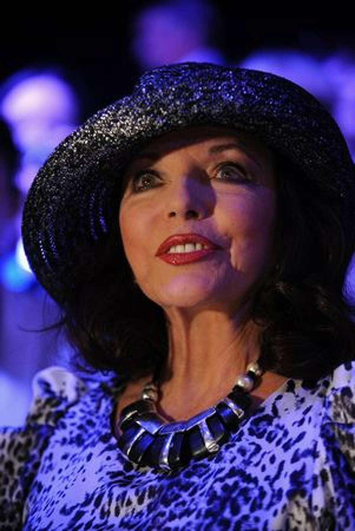 Joan Collins attends the Caroline Charles Fashion Show during London Fashion Week at Somerset House in London, England.