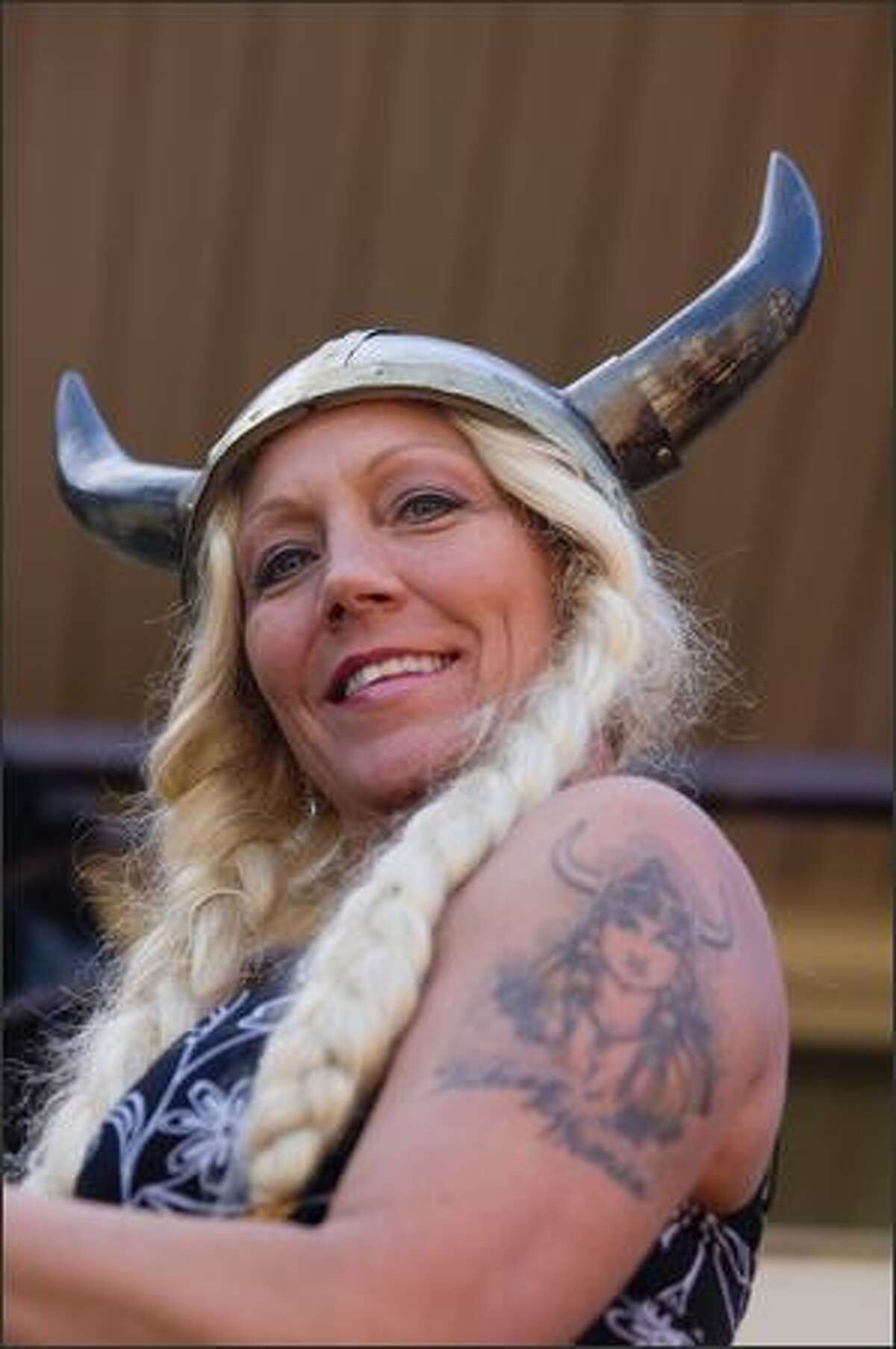 Lisa Hageselle's Viking hat matches the Viking tattoo on her arm while marching during the Norwegian Constitution Day parade in Ballard Sunday.