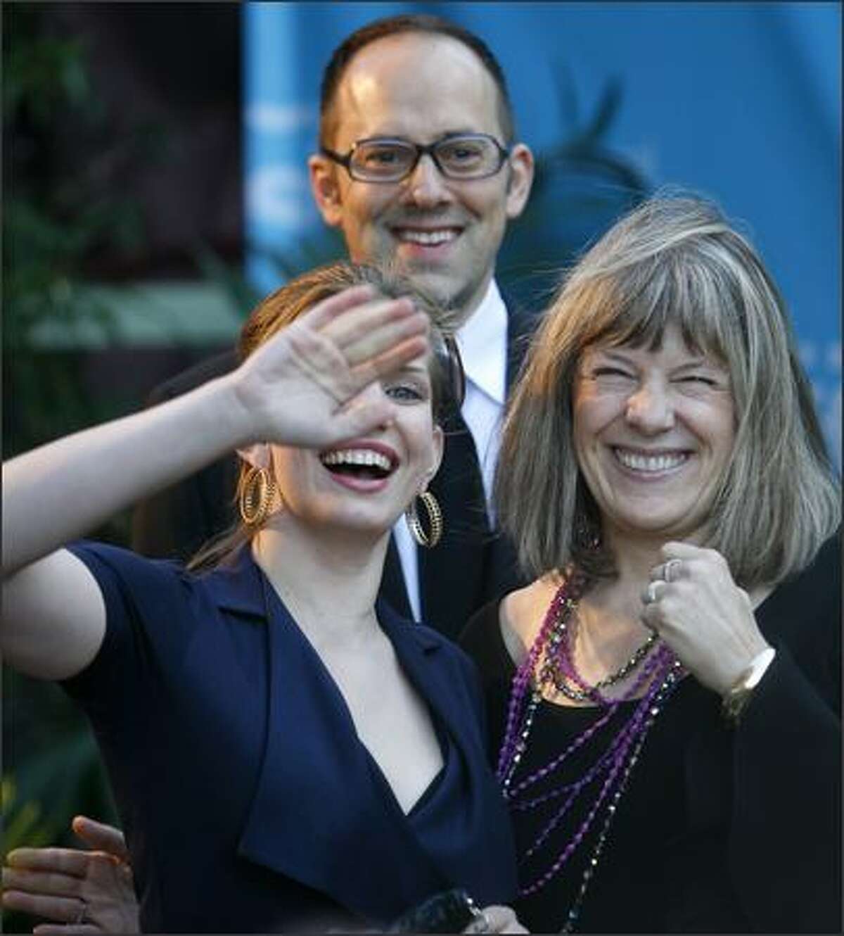 From left, Anna Chulmsky, SIFF artistic director Carl Spence and Mimi Kennedy walk the red carpet during the Seattle International Film Festival's opening show and gala party at the Paramount Theater on Thursday, May 21, 2009.