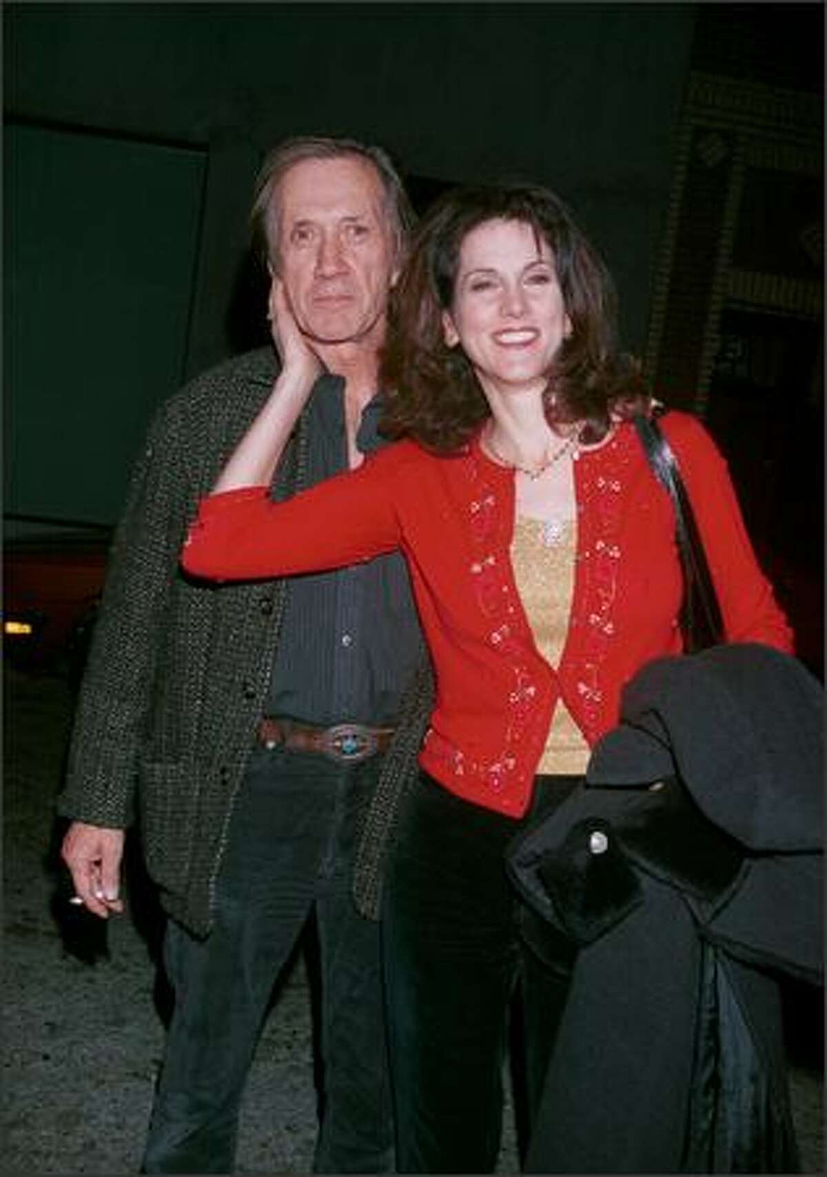 Actor David Carradine and his fourth wife, Marina, attend a party and final shoot for "Joe Head Goes Hollywood" Dec. 17, 2000 in Venice, Calif. (Photo by Newsmakers)