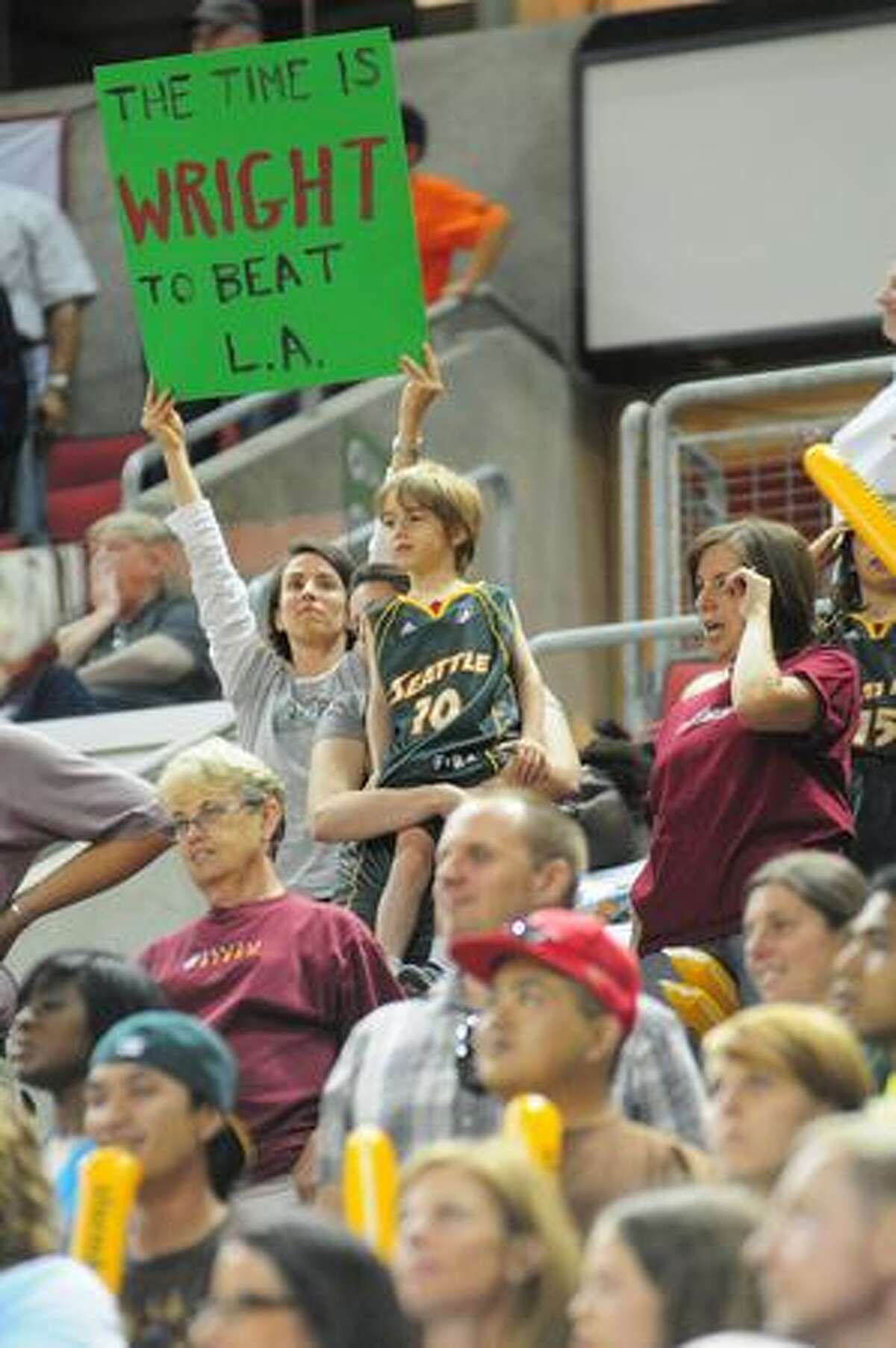 A Seattle Storm fan holds up a sign during the 3rd quarter of play. Photo by Daniel Berman/SeattlePI.com