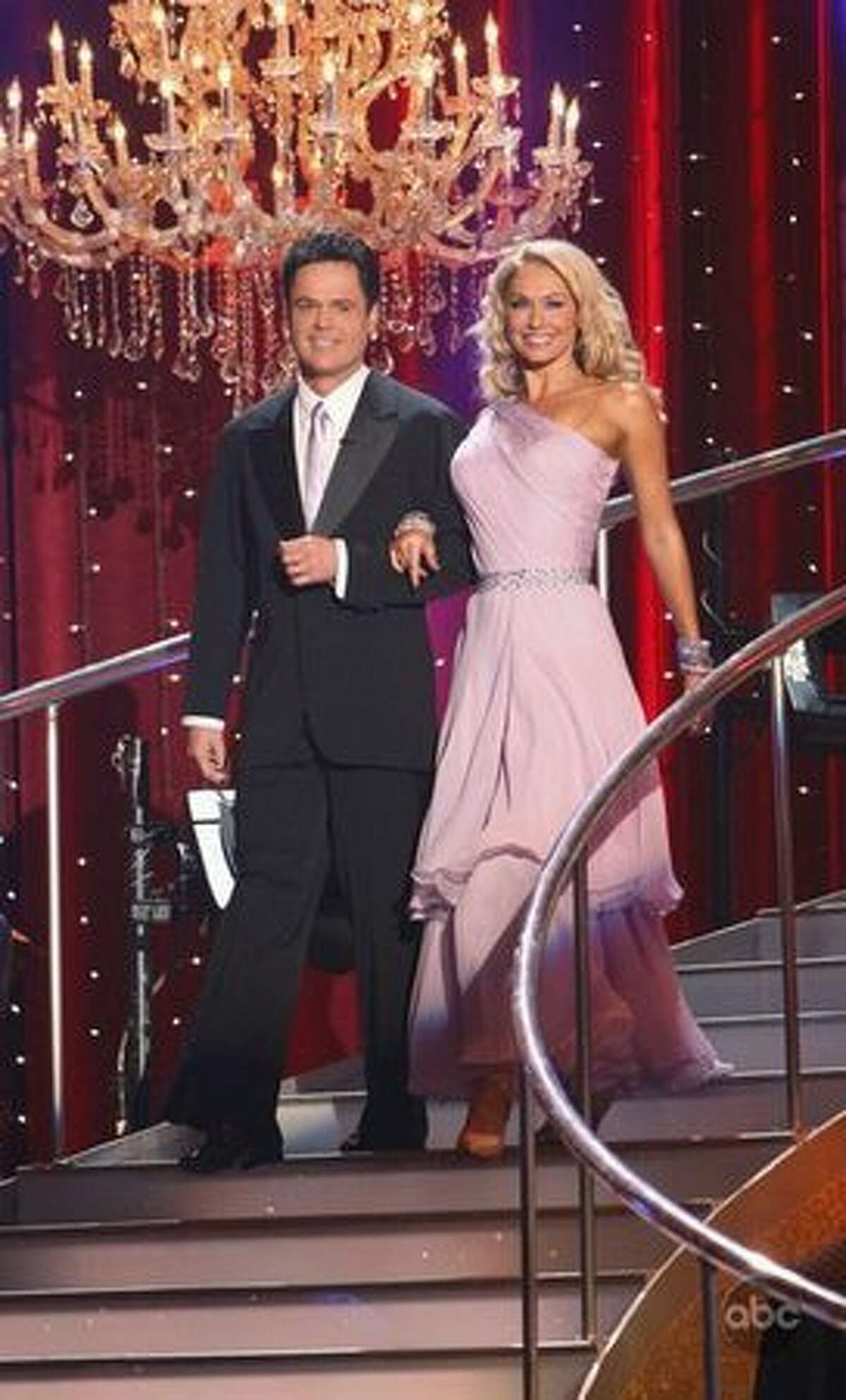Singer Donny Osmond and professional dancer Kym Johnson are introduced.