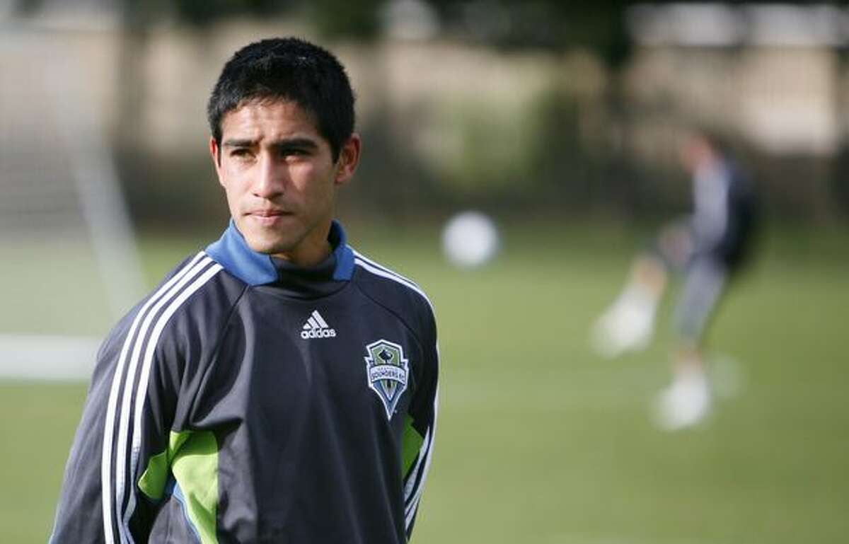 Seattle Sounders draft pick David Estrada stands on the sidelines during the first day of training camp on Monday at Starfire Sports Complex in Tukwila.
