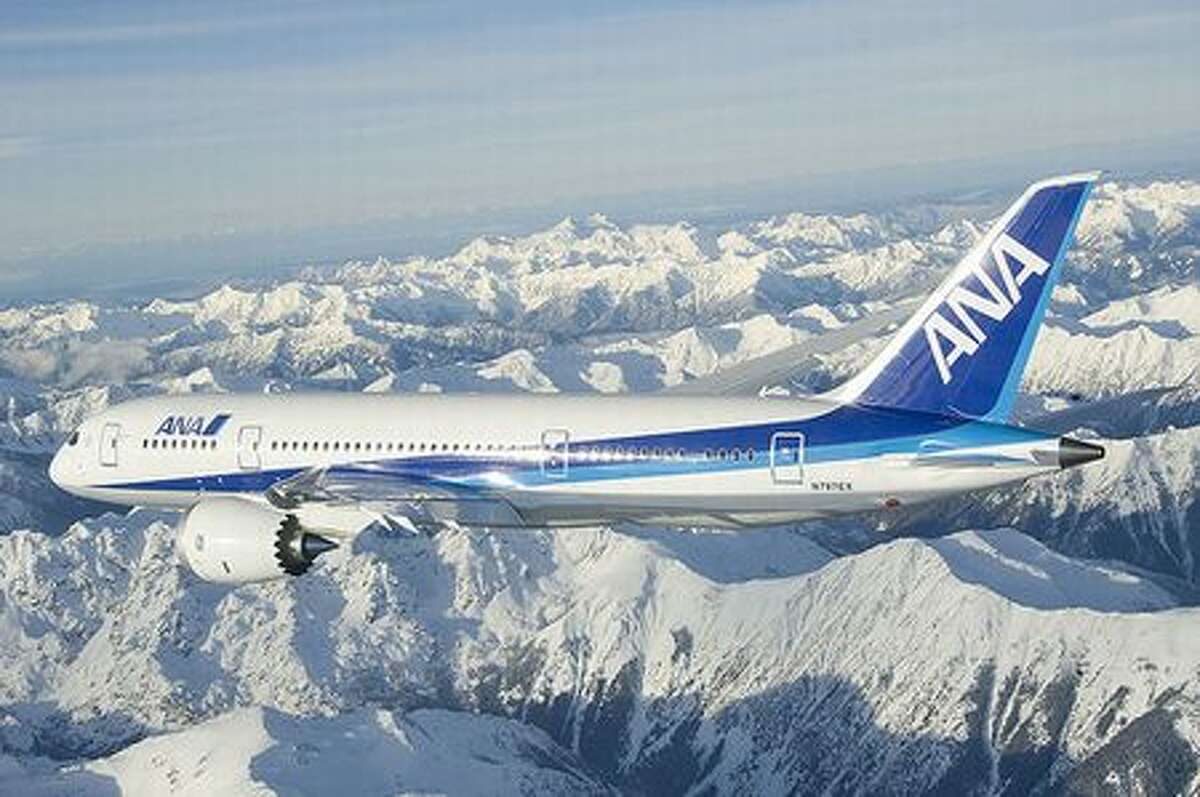 Boeing's second 787 Dreamliner over the Olympic Mountains during its first test flight, on Dec 22, 2009. (via Future of Flight)