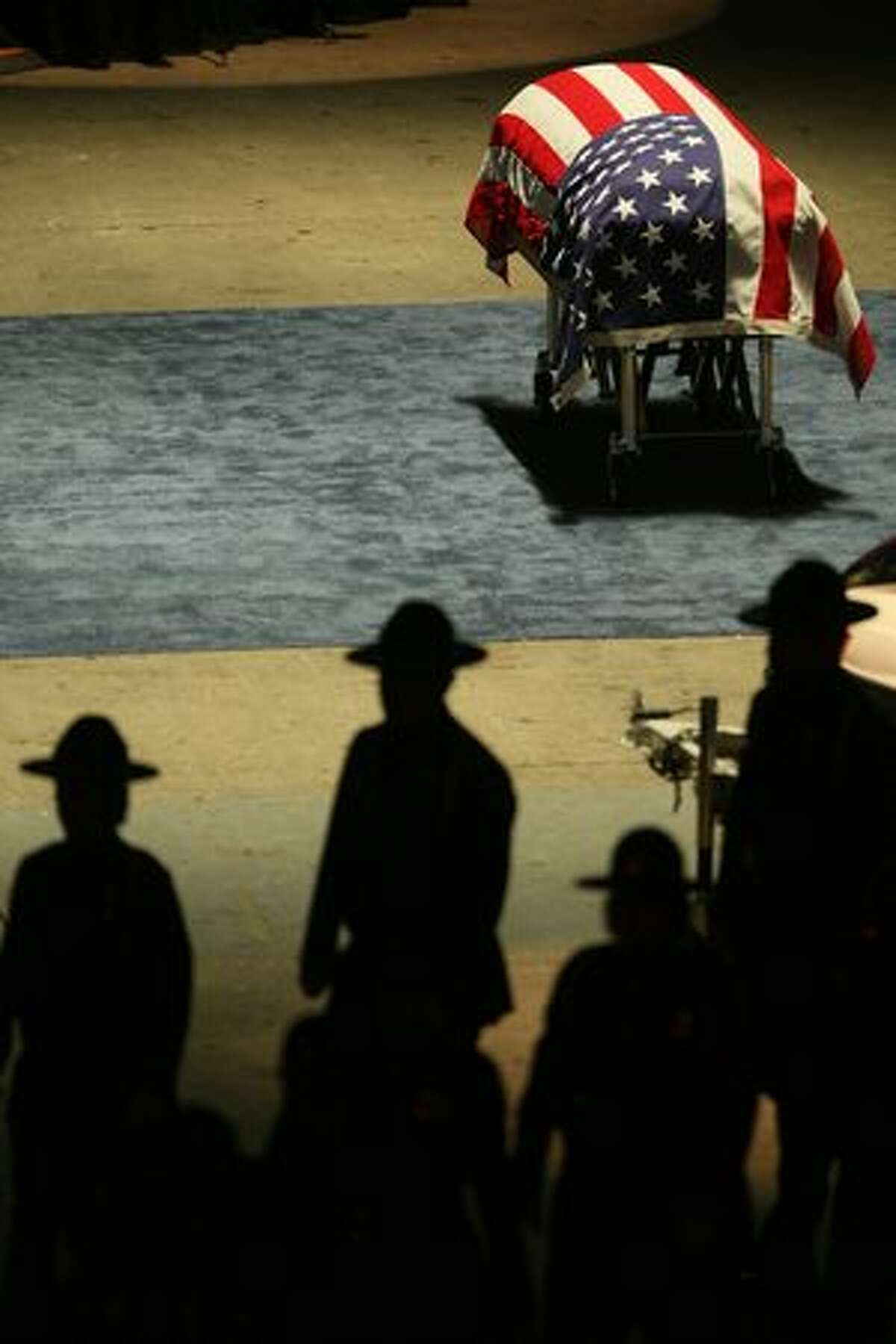 The casket sits near the stage during the memorial service for Pierce County Sheriff's Deputy Kent Mundell, Jr. at the Tacoma Dome Jan. 5, 2010.