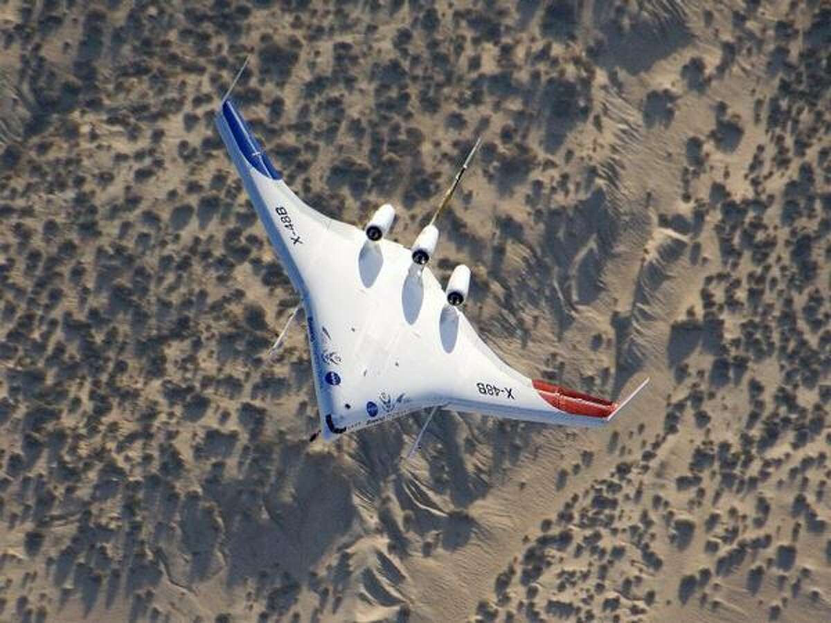 The unique X-48B Blended Wing Body subscale demonstrator banks over desert scrub at Edwards Air Force Base during the aircraft's fifth test flight Aug. 14, 2007. (NASA/Carla Thomas)