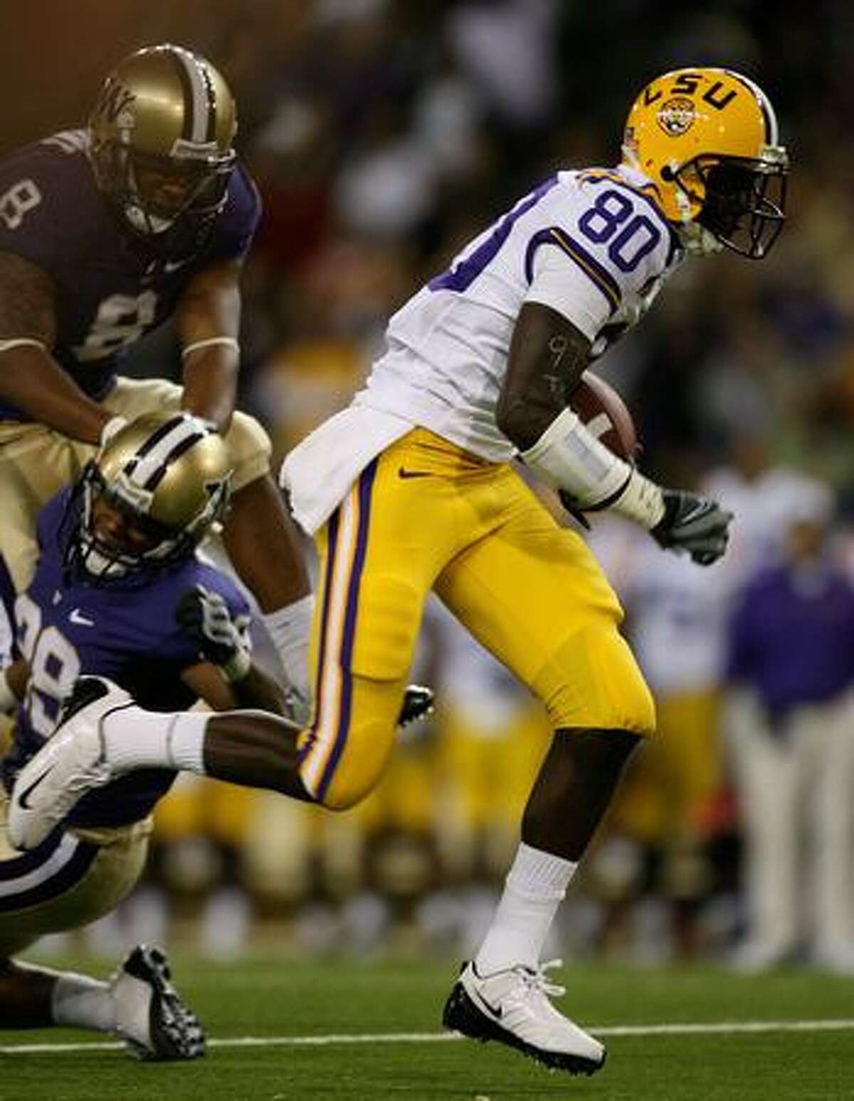 SEATTLE - SEPTEMBER 05: Wide receiver Terrance Toliver #80 of the LSU Tigers moves the ball after making a catch on a 49 yard touchdown play against the Washington Huskies on September 5, 2009 at Husky Stadium in Seattle, Washington.
