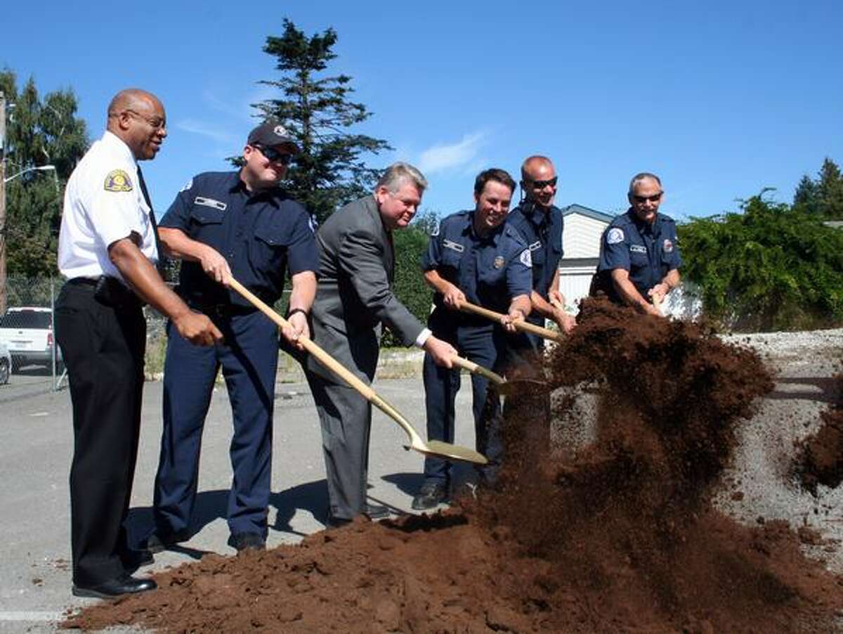 Seattle Fire Chief Gregory Dean, left, and Mayor Greg Nickels, in suit, during the Sept. 10, 2009 groundbreaking ceremony for Station 38.