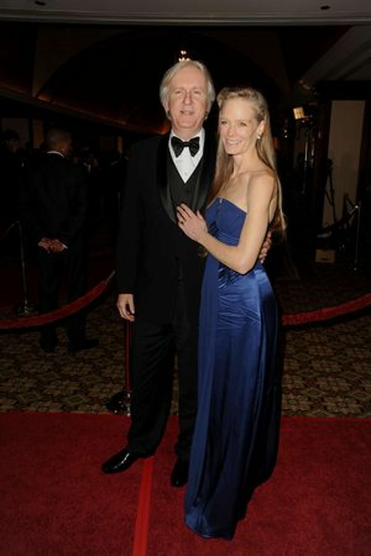 Director James Cameron (L) and wife Suzy Amis arrive.