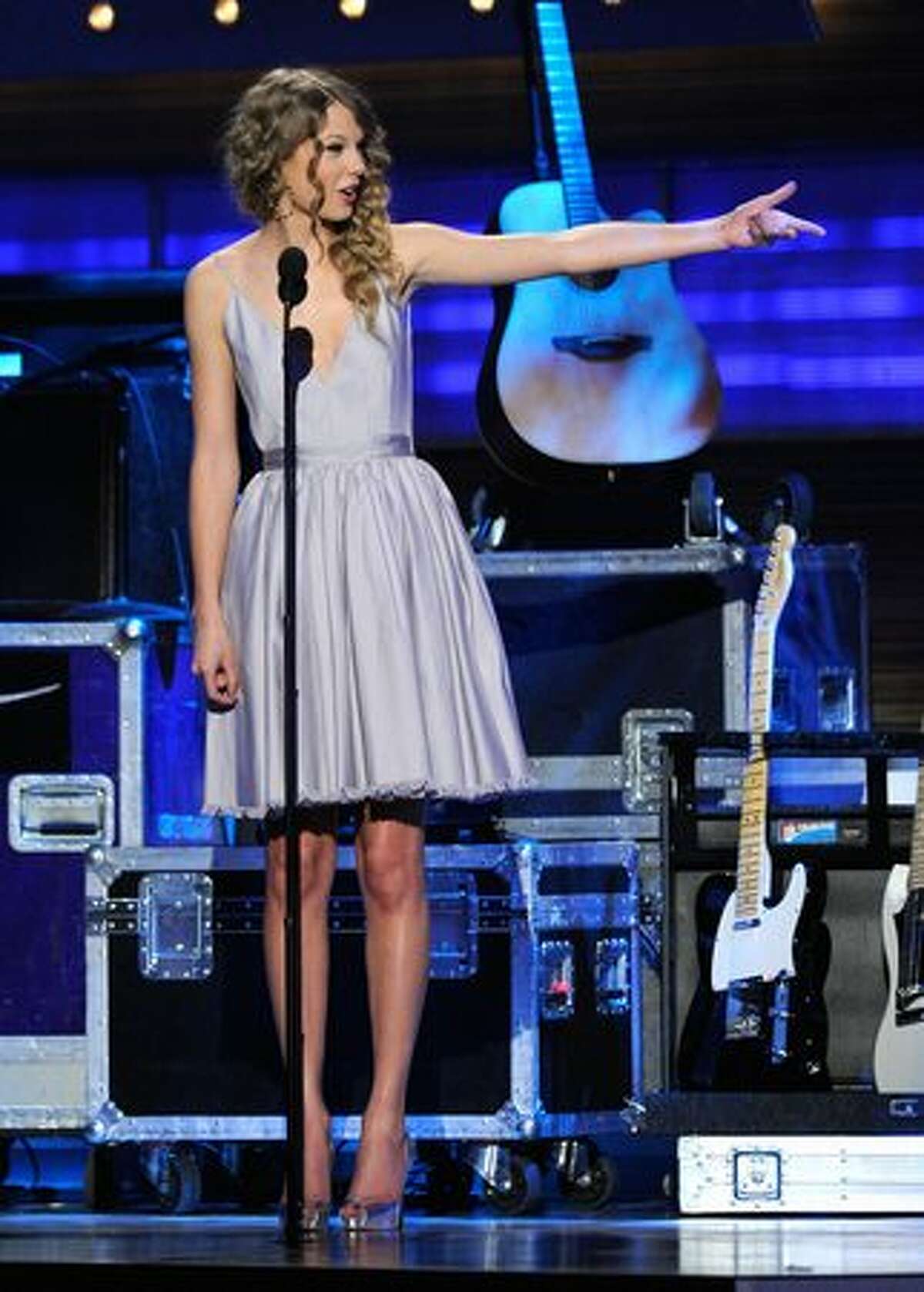 Singer Taylor Swift walks onstage.